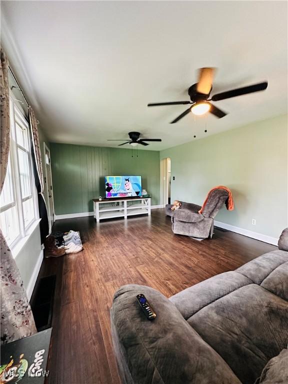418 Main St, Philo, OH 43771 - living area with wood finished floors, baseboards, and a ceiling fan