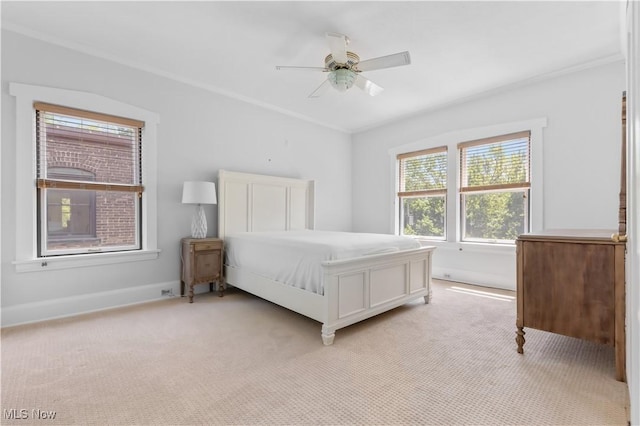 2472 Overlook Rd Unit 11, Cleveland Heights, OH 44106 - bedroom with light carpet, ornamental molding, a ceiling fan, and baseboards