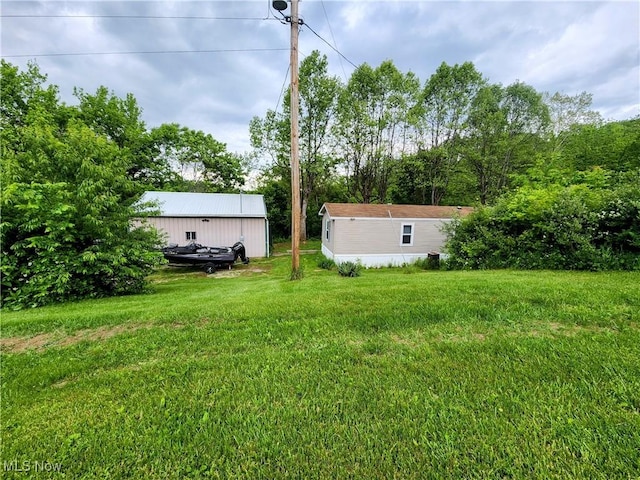 6960 Bluebell Rd, Cumberland, OH 43732 - view of green lawn with an outdoor structure