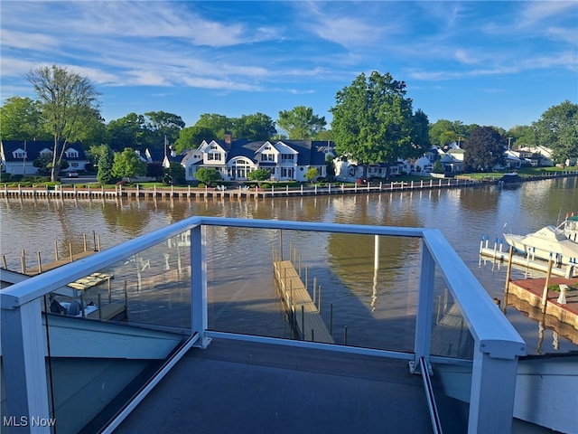 629 Main St, Vermilion, OH 44089 - dock area featuring a water view and a residential view