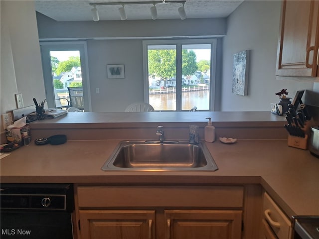 629 Main St, Vermilion, OH 44089 - kitchen with a sink, track lighting, and a water view