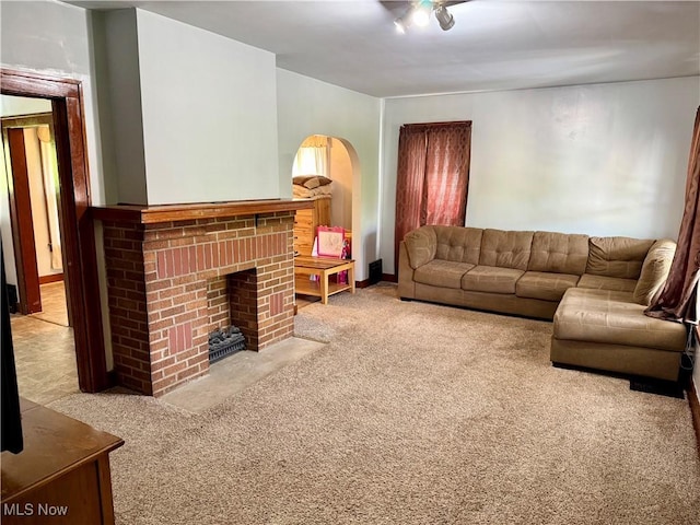 237 Beech Rd, Weirton, WV 26062 - carpeted living room featuring a fireplace and arched walkways