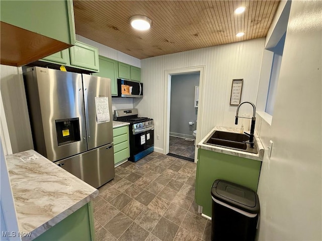 610 N 5th St, Cambridge, OH 43725 - kitchen featuring green cabinets, stainless steel appliances, a sink, light countertops, and recessed lighting