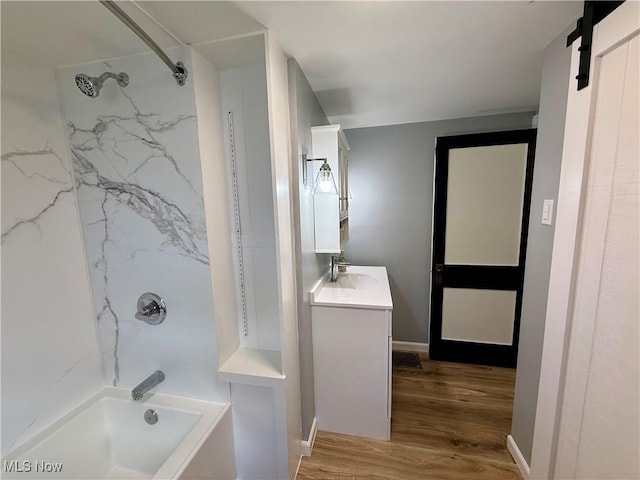 610 N 5th St, Cambridge, OH 43725 - full bathroom featuring vanity, tub / shower combination, and wood finished floors