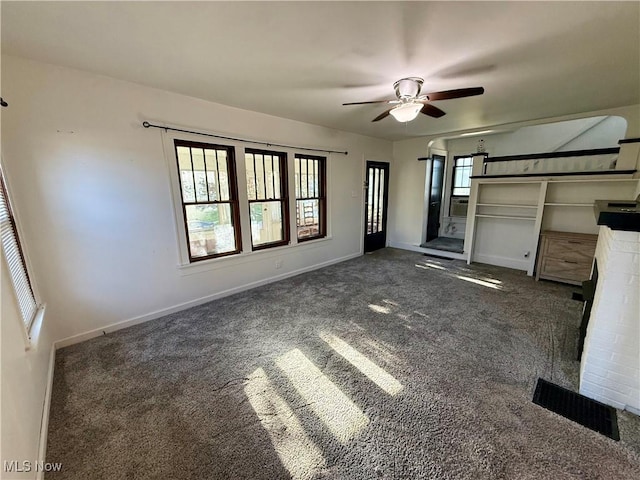 610 N 5th St, Cambridge, OH 43725 - unfurnished living room with carpet, ceiling fan, and baseboards