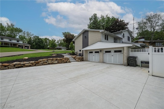 4184 Meadowview Dr NW, Canton, OH 44718 - view of side of home featuring brick siding and concrete driveway