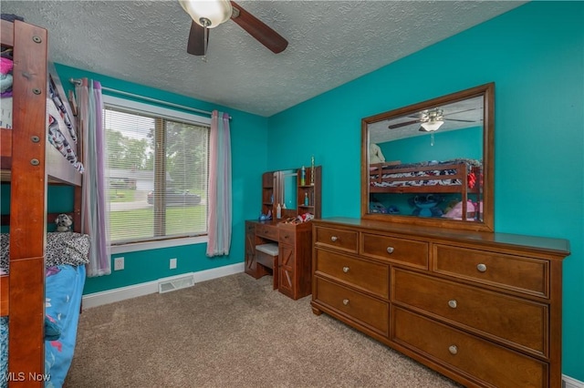 4184 Meadowview Dr NW, Canton, OH 44718 - carpeted bedroom featuring baseboards, a textured ceiling, and a ceiling fan
