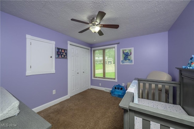 4184 Meadowview Dr NW, Canton, OH 44718 - bedroom featuring carpet flooring, a textured ceiling, baseboards, a closet, and a ceiling fan