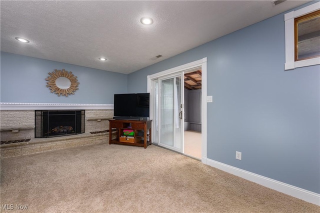4184 Meadowview Dr NW, Canton, OH 44718 - unfurnished living room featuring carpet floors, a textured ceiling, a brick fireplace, recessed lighting, and baseboards