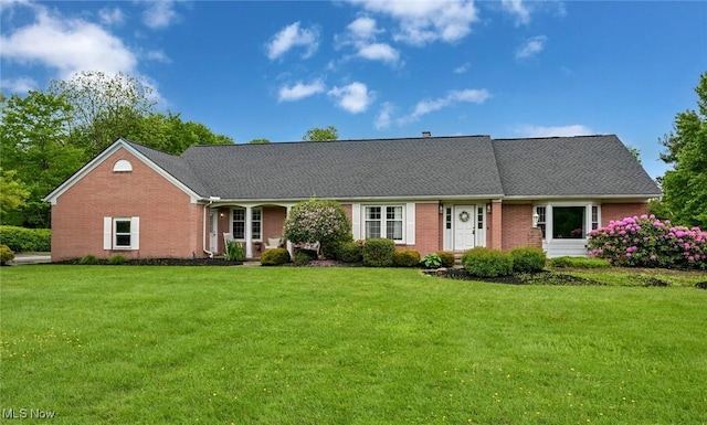 12115 Fowlers Mill Rd, Chardon, OH 44024 - view of front of home with a front yard and brick siding