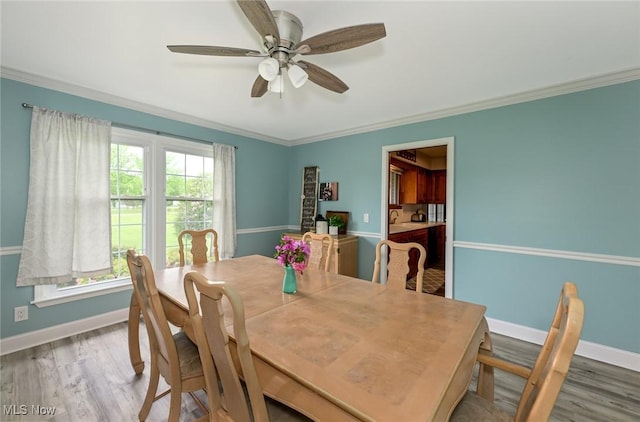 12115 Fowlers Mill Rd, Chardon, OH 44024 - dining room with wood finished floors, baseboards, crown molding, and a ceiling fan