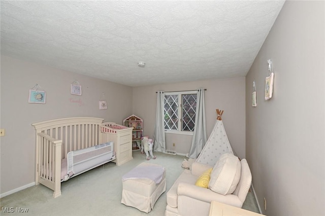 12115 Fowlers Mill Rd, Chardon, OH 44024 - carpeted bedroom with a nursery area, a textured ceiling, and baseboards