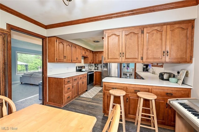 12115 Fowlers Mill Rd, Chardon, OH 44024 - kitchen featuring stainless steel appliances, a sink, light countertops, crown molding, and brown cabinetry