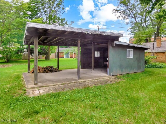192 Walnut St, Geneva, OH 44041 - view of parking featuring a carport