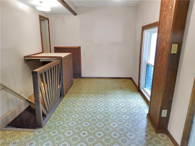 192 Walnut St, Geneva, OH 44041 - hall with an upstairs landing, light floors, and baseboards