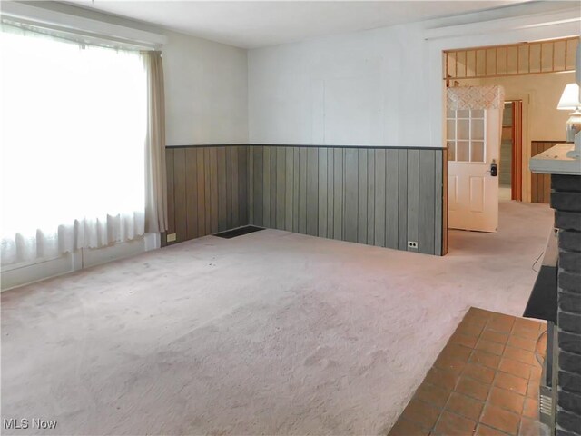 192 Walnut St, Geneva, OH 44041 - carpeted spare room featuring wainscoting