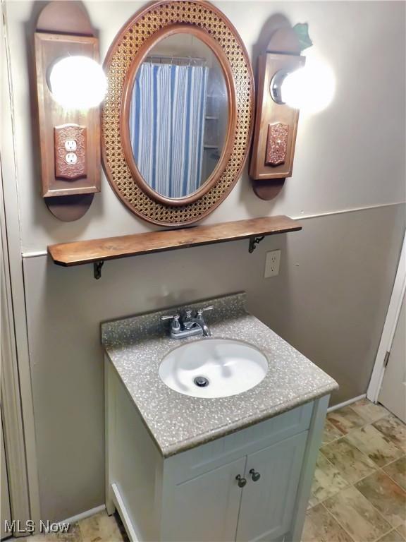 192 Walnut St, Geneva, OH 44041 - bathroom featuring vanity and baseboards