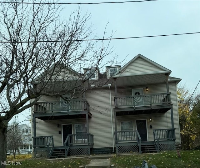 666 Parkwood Rd, Cleveland, OH 44108 - view of front facade with a balcony and a front yard