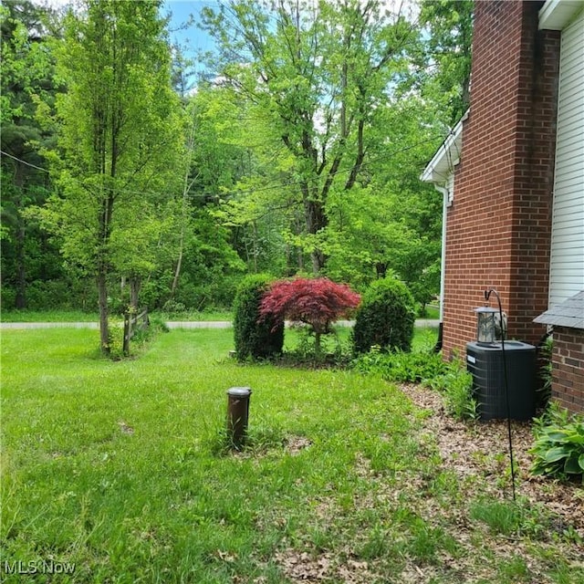 13423 Price St NE, Alliance, OH 44601 - view of green lawn with central air condition unit