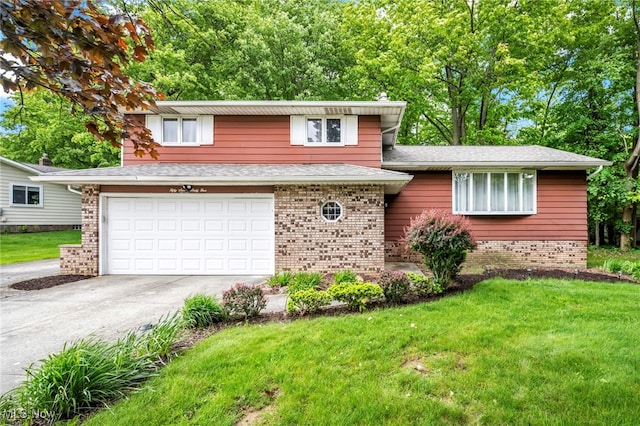 5765 Janet Blvd, Solon, OH 44139 - tri-level home with an attached garage, a front lawn, concrete driveway, brick siding, and a shingled roof