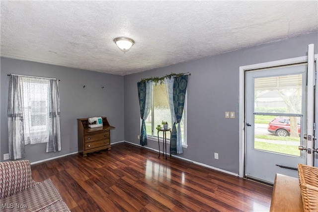 13102 Liberty Ave, Cleveland, OH 44135 - doorway to outside featuring wood finished floors, plenty of natural light, a textured ceiling, and baseboards