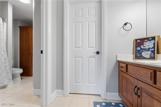 1014 Kings Ridge Blvd, Wadsworth, OH 44281 - bathroom featuring vanity, toilet, tile patterned floors, and baseboards
