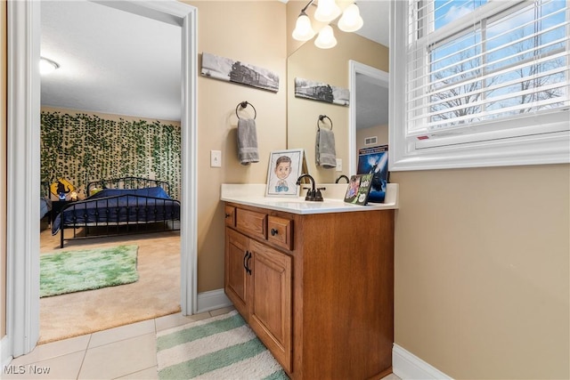 1014 Kings Ridge Blvd, Wadsworth, OH 44281 - bathroom with vanity, tile patterned floors, baseboards, and a chandelier