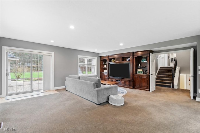 1014 Kings Ridge Blvd, Wadsworth, OH 44281 - living room with light colored carpet, stairway, baseboards, and recessed lighting