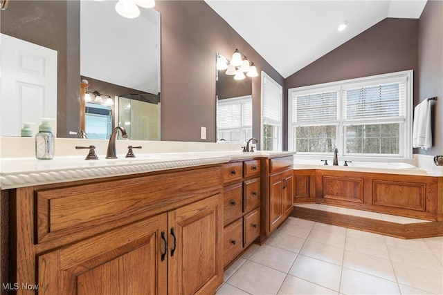1014 Kings Ridge Blvd, Wadsworth, OH 44281 - full bath featuring vaulted ceiling, tile patterned flooring, double vanity, and a garden tub