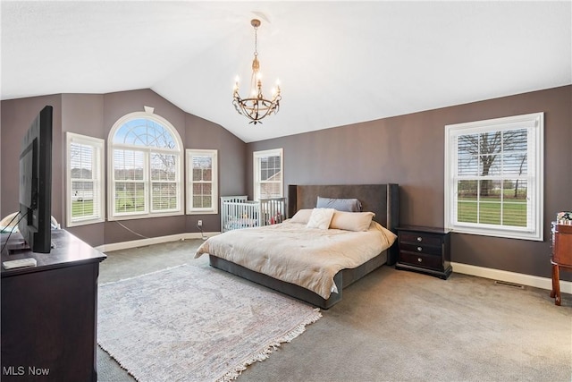 1014 Kings Ridge Blvd, Wadsworth, OH 44281 - bedroom with carpet flooring, a chandelier, vaulted ceiling, and baseboards