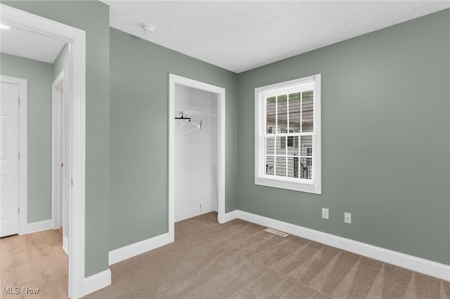 6937 Reynolds Rd, Mentor, OH 44060 - unfurnished bedroom with baseboards, a closet, and carpet floors