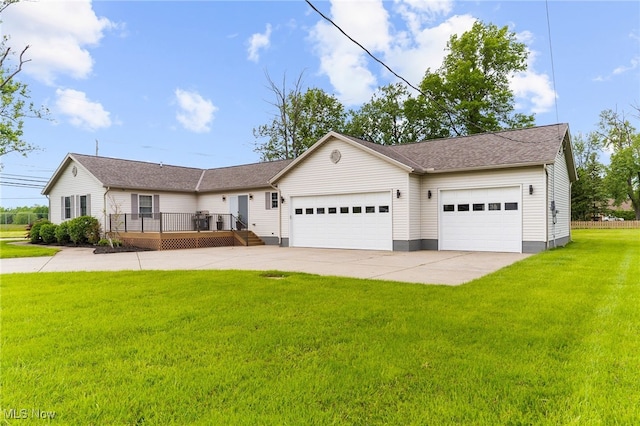 6937 Reynolds Rd, Mentor, OH 44060 - view of front facade featuring a deck, a front yard, concrete driveway, and a garage