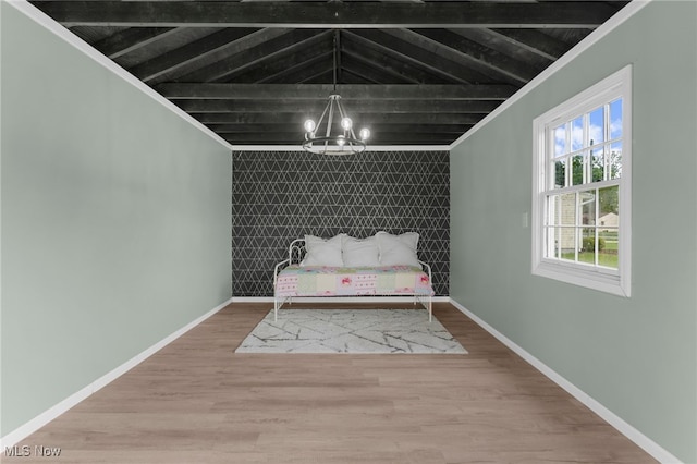 6937 Reynolds Rd, Mentor, OH 44060 - bedroom with an accent wall, a chandelier, baseboards, wood finished floors, and beamed ceiling