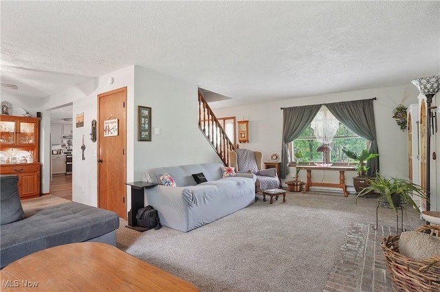 22010 Mountz Rd, Minerva, OH 44657 - carpeted living area featuring a textured ceiling and stairway