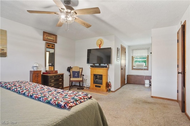 22010 Mountz Rd, Minerva, OH 44657 - bedroom with carpet flooring, baseboards, a glass covered fireplace, a textured ceiling, and a ceiling fan