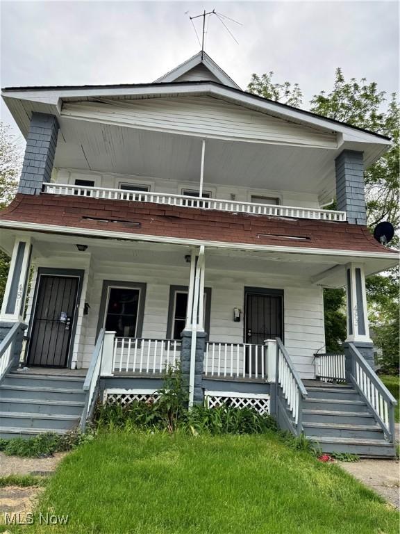 483 E 128th St, Cleveland, OH 44108 - view of front facade featuring covered porch