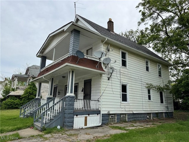 483 E 128th St, Cleveland, OH 44108 - view of front of property with a chimney and a porch