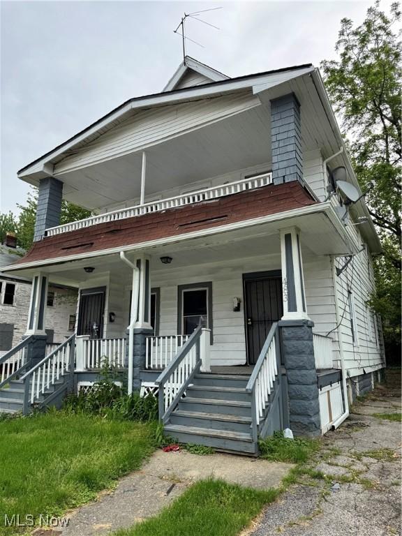 483 E 128th St, Cleveland, OH 44108 - view of front of house featuring covered porch