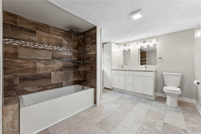 608 Arch St, Salem, OH 44460 - full bathroom featuring double vanity, toilet, bathing tub / shower combination, a textured ceiling, and baseboards