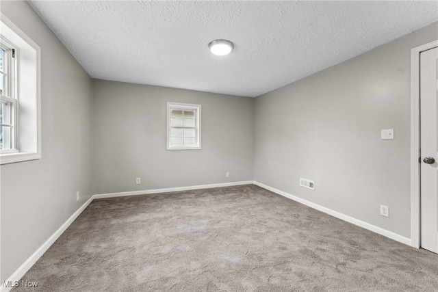 608 Arch St, Salem, OH 44460 - unfurnished room with a textured ceiling, carpet, and baseboards