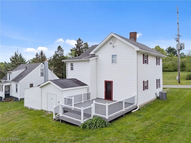 608 Arch St, Salem, OH 44460 - back of house featuring central air condition unit, a deck, a chimney, and a yard