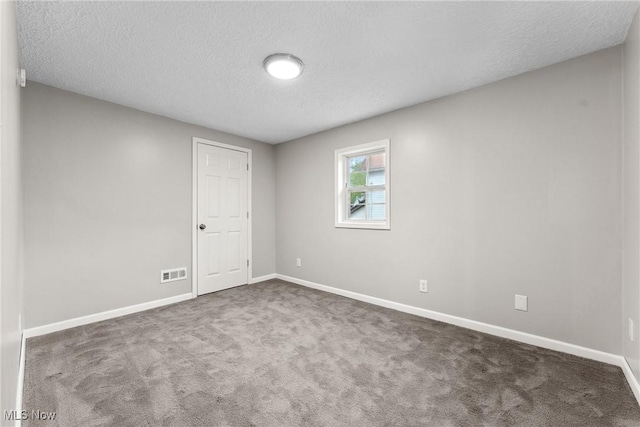 608 Arch St, Salem, OH 44460 - spare room with a textured ceiling, baseboards, and carpet