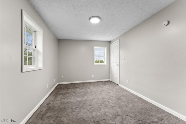 608 Arch St, Salem, OH 44460 - unfurnished room with a textured ceiling, carpet flooring, baseboards, and a smoke detector