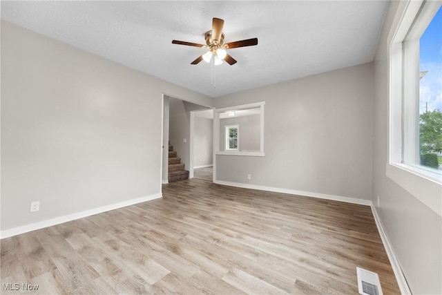 608 Arch St, Salem, OH 44460 - empty room featuring plenty of natural light, a ceiling fan, and wood finished floors