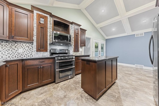 153 Cheyenne Trl, Malvern, OH 44644 - kitchen featuring appliances with stainless steel finishes, tasteful backsplash, a center island, dark stone countertops, and french doors