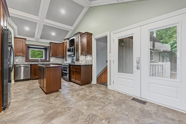 153 Cheyenne Trl, Malvern, OH 44644 - kitchen with appliances with stainless steel finishes, french doors, decorative backsplash, a center island, and recessed lighting