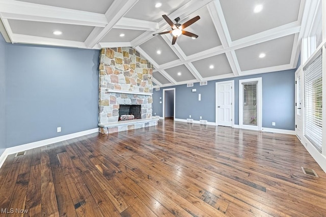 153 Cheyenne Trl, Malvern, OH 44644 - unfurnished living room with a ceiling fan, hardwood / wood-style flooring, baseboards, a stone fireplace, and recessed lighting
