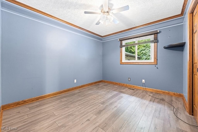 153 Cheyenne Trl, Malvern, OH 44644 - empty room featuring crown molding, a textured ceiling, wood finished floors, ceiling fan, and baseboards