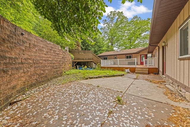 153 Cheyenne Trl, Malvern, OH 44644 - fenced backyard featuring a patio area and a deck