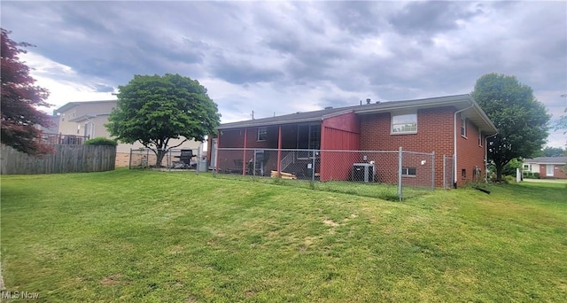 2126 Mctaggart St, Belpre, OH 45714 - rear view of property with central AC unit and brick siding